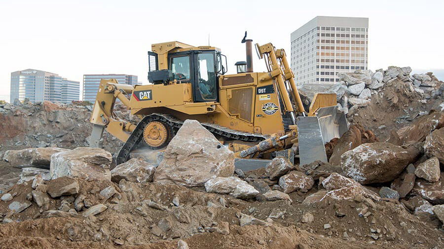 Construction equipment on pile of rocks